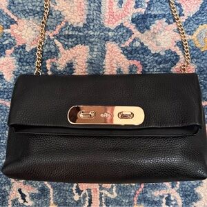 Brand new Coach swagger clutch in black pebbled grain leather